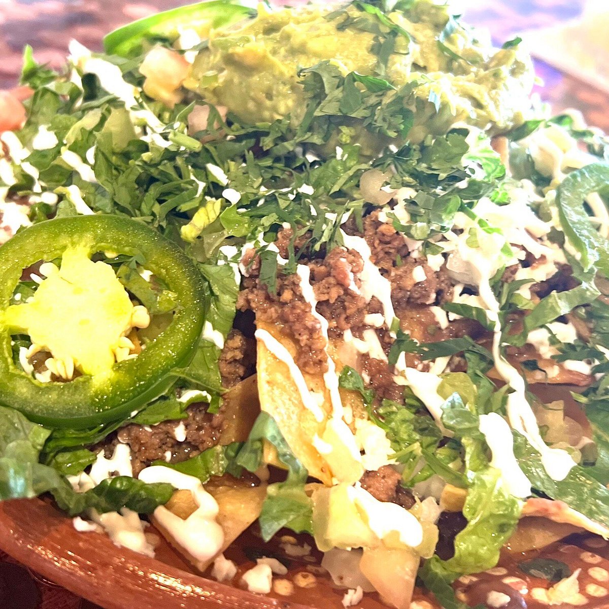 Rivales Taqueria & Craft Bar signature dishes Nachos Chicken BowlCarne Asada Taco
